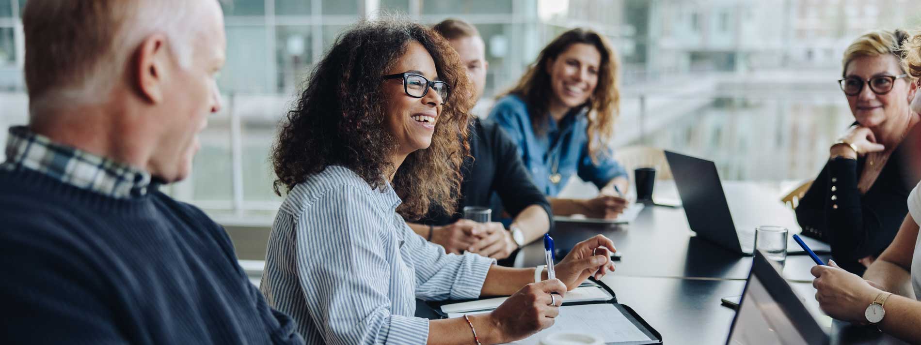 Group-of-employees-sitting-together-in-meeting-room