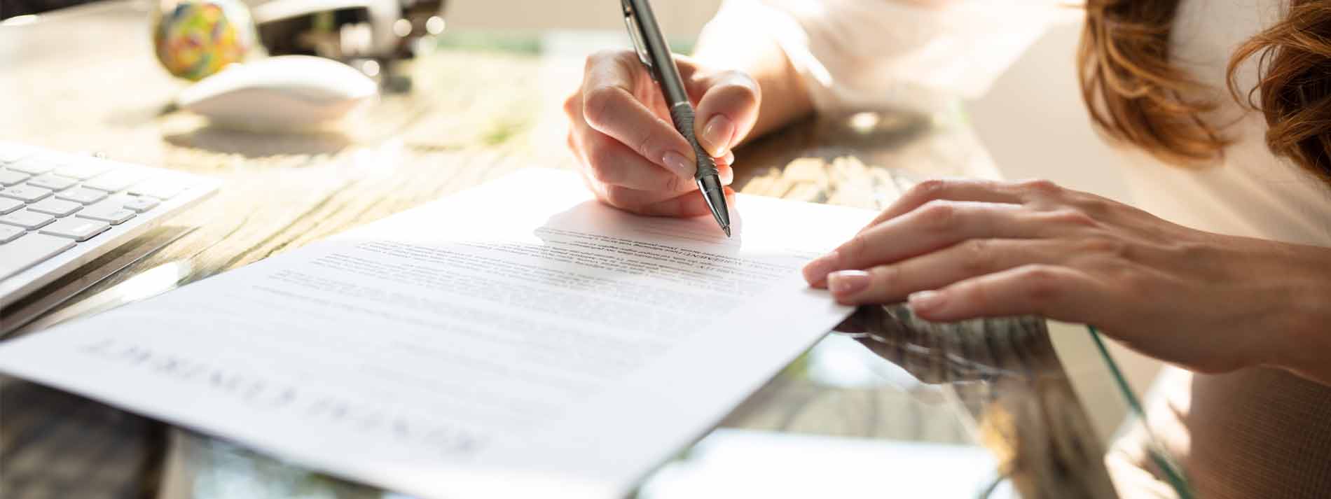 hero-woman-signing-papers