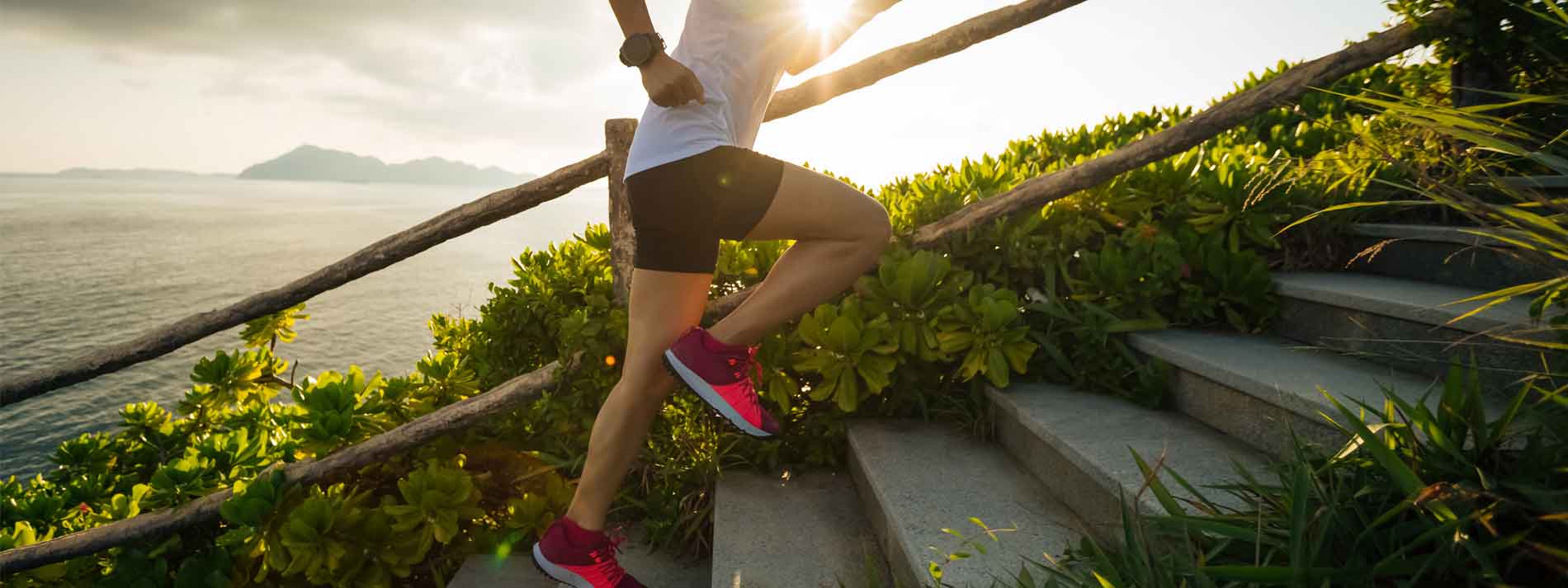 person-running-outside-up-stairs