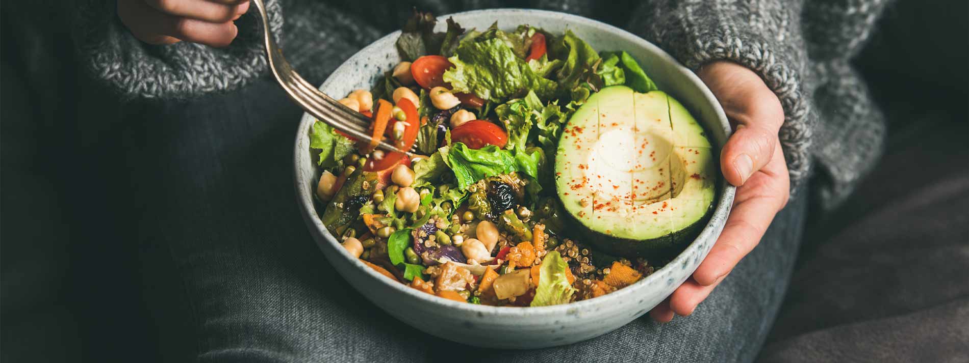 Woman-eating-healthy-vegetarian-bowl