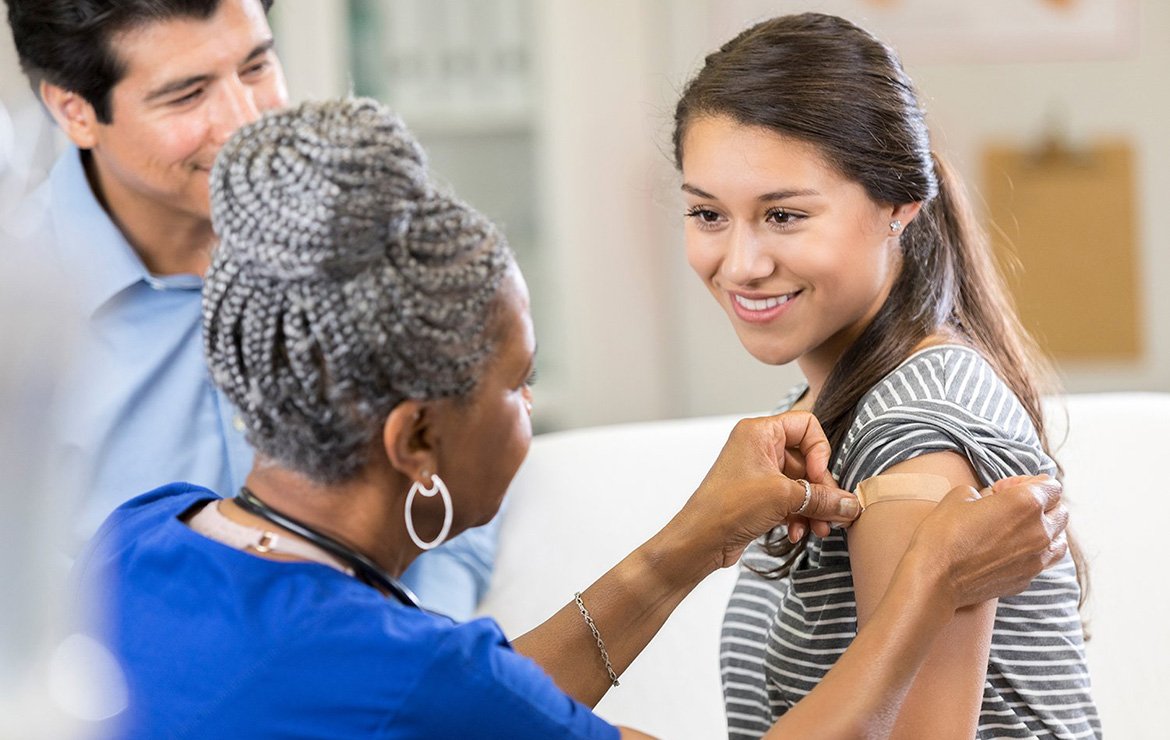 https://www.sharphealthplan.com/images/default-source/site-images/hero-images/young-woman-receiving-band-aid-in-arm-from-nurse-1170x740.jpg?sfvrsn=932da080_3