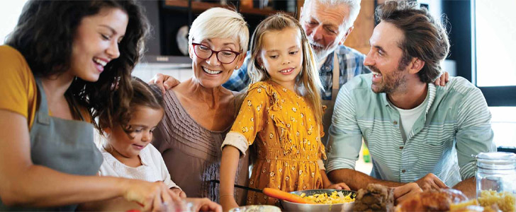 Multigenerational family celebrating holidays together in kitchen