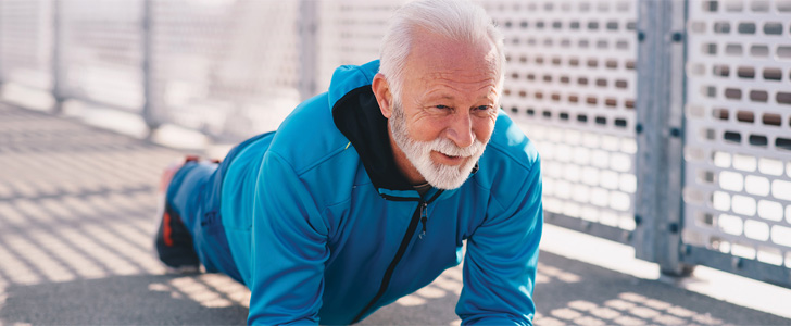 Older man holding plank position