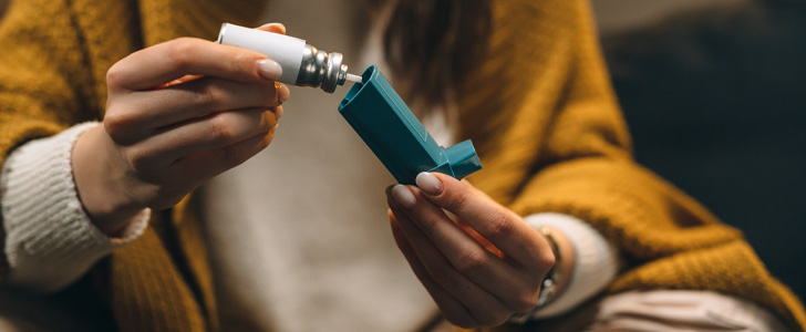 Close up of asthma inhaler being replaced