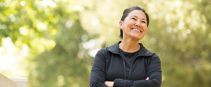 Woman smiling outside at the park